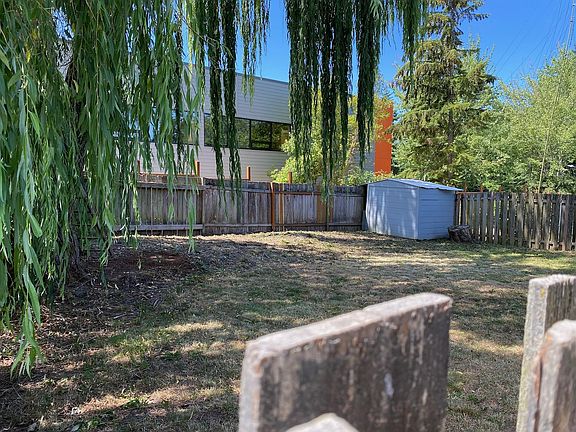 Fenced Backyard Access side gate or thru garage