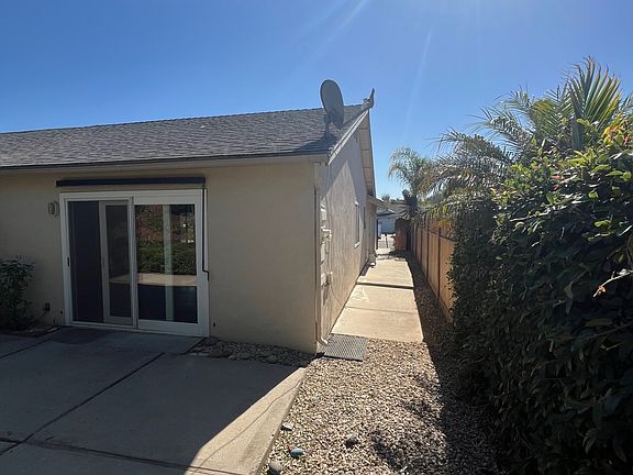 Slider from living room to access the back yard. Side yard with gate for access from the front.