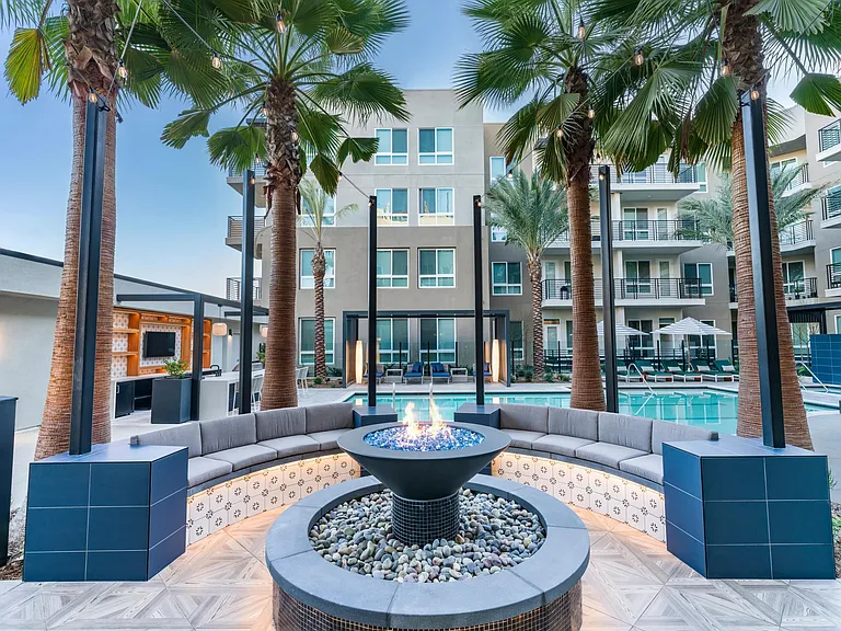 Modera Pomona features a fire pit near the pool, perfect for relaxing and enjoying the outdoors.