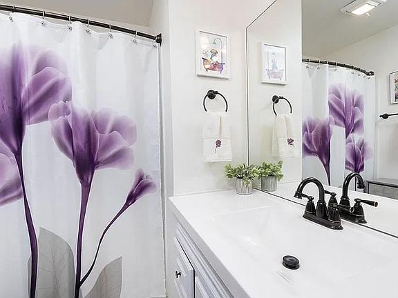new bathroom countertop with integrated sink. Large walk in shower