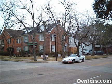 prominent corner lot in lovely setting