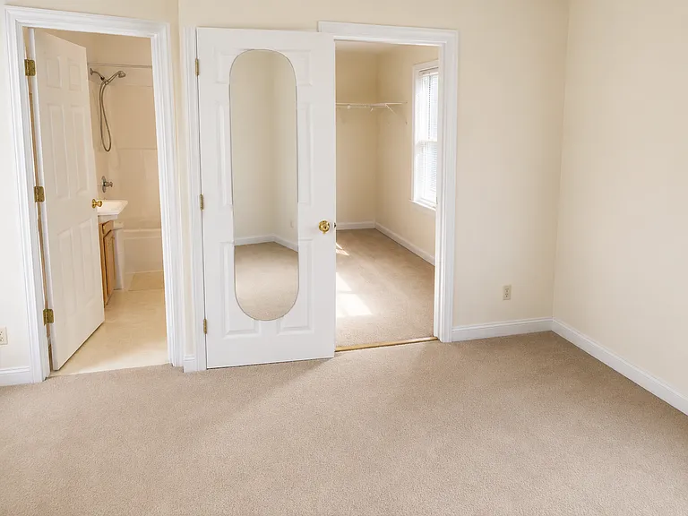 Bedroom includes a large sunny walk-in closet