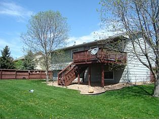 Deck w/stairs leading to fenced yard