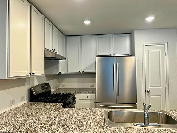 Well maintained granite countertops, stainless steel appliances, and food pantry are included in the kitchen.