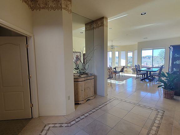 Spacious welcoming entryway. Den/Office is to the left. Guest room and 2nd bath to the right. Master separate off living room. Entire house has 10 ft. ceilings.