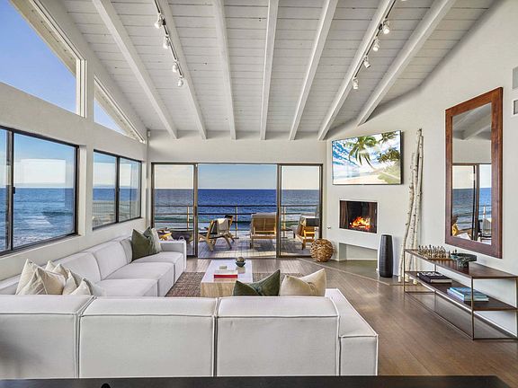 Step into a sunlit sanctuary where ocean views greet you at every turn.