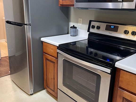 Fully equipped kitchen with range, dishwasher, microwave garbage disposal and new refrigerator, lots of cabinet space