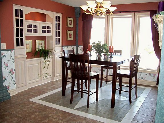 Dining room with custom tile and built in hutch.