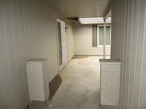 Walk-way from driveway toward the front door and courtyard