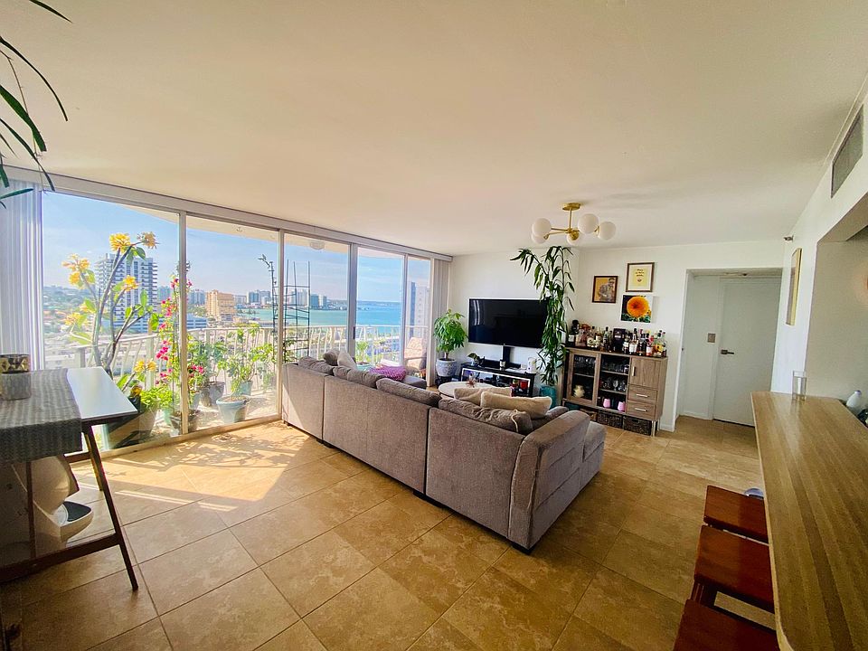 Open living area with floor to ceiling windows