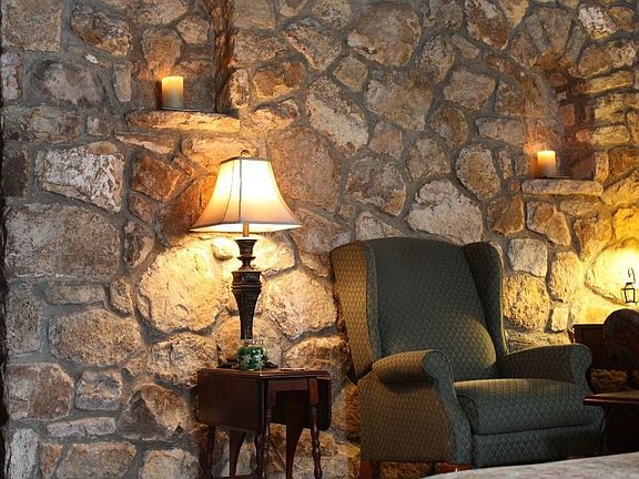 beautiful stone wall with niches in living room