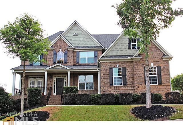 Beautiful brick and cedar shake exterior. Entire exterior freshly painted. Craftsman style three car garage at side entry