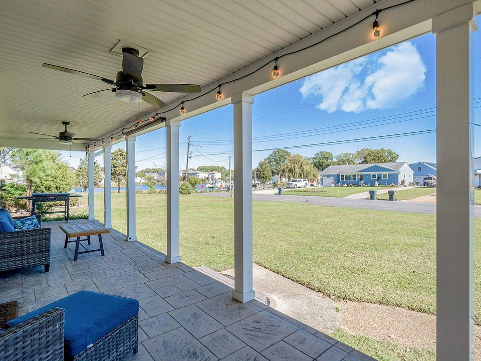 Enormous front porch with saltwater views. Watch the boats go by...