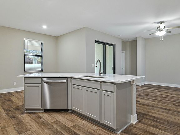 The kitchen also has a large island that is ready to be the center of your home