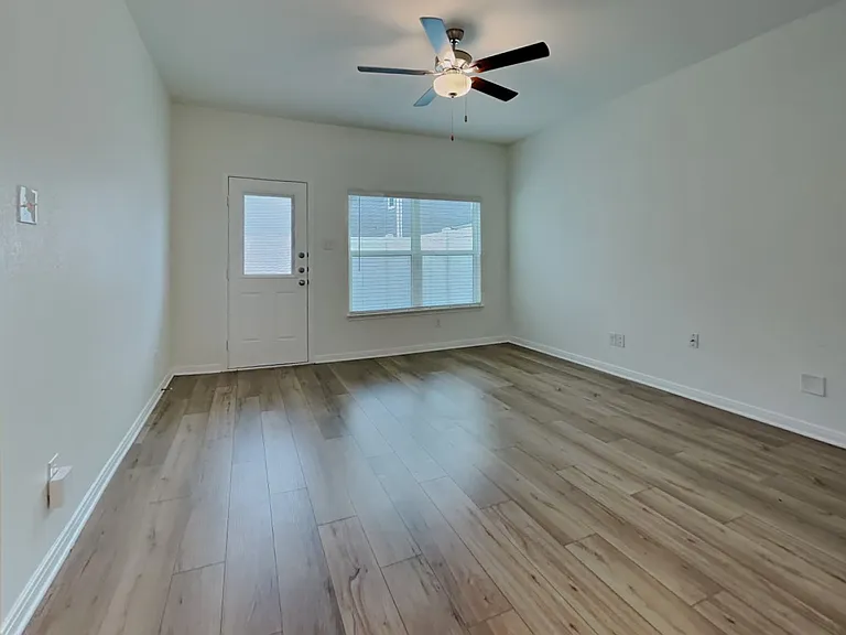 Spacious room with neutral wal