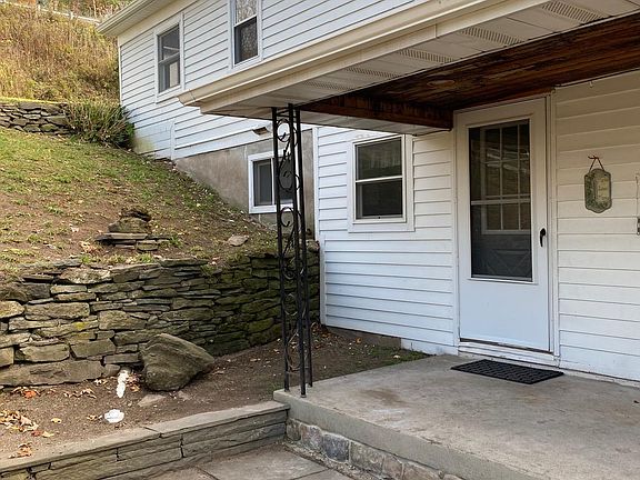 Stone Patio off of L-Shaped Porch