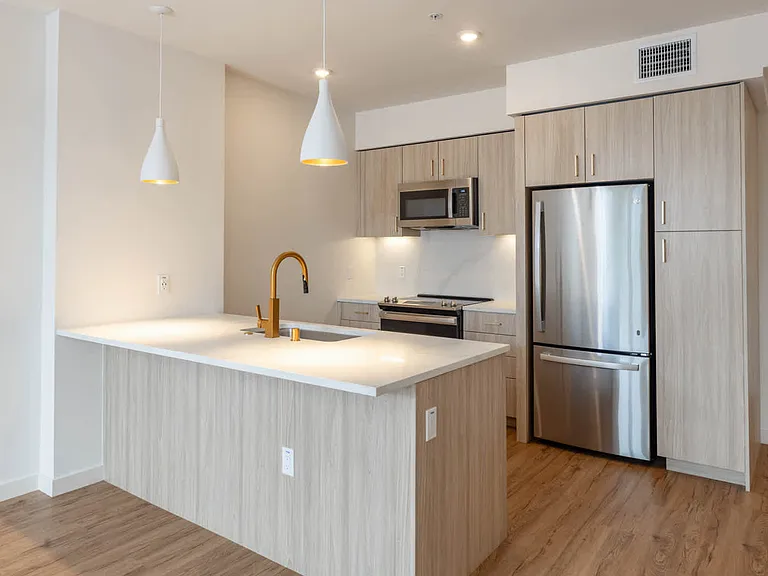 Kitchen with Stainless Steel Appliances and Quartz Countertops