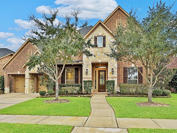 Welcome home! You will love this Trendmaker home that features five bedrooms, with two bedrooms on the first floor. There is a three car tandem garage attached to the home. There are four full bathrooms and one powder room.