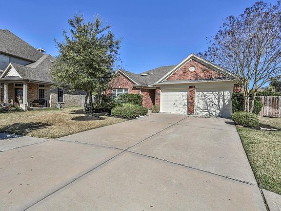 Well landscaped 1.5 story split floor plan with 2 car attached garage.