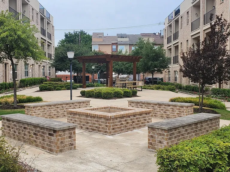 Community courtyard with firepit and pergola w/ bbq grills & pet stations