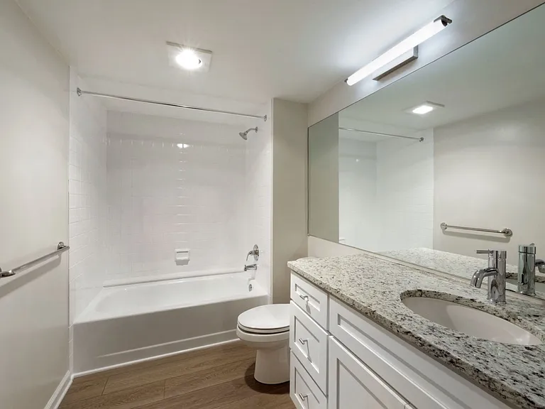 Renovated bathroom with granite countertops