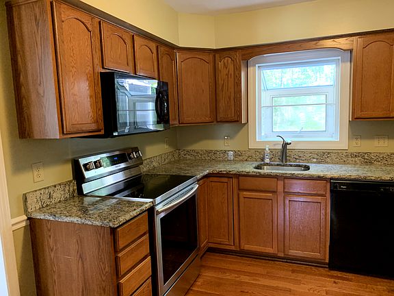 1st: Kitchen from hall (range, microwave, sink)
