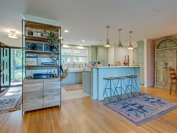 Open floor plan kitchen, living, and dining