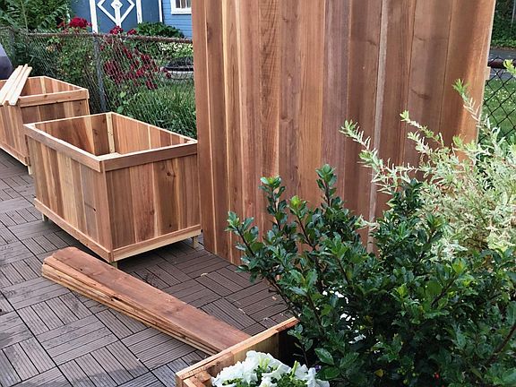 Deck area in front of the garage (planters now have arborvitaes for screening.