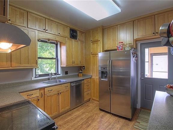 Stunning Kraftsmaid Kitchen with room for all your culinary tools and appliances! New stainless appliances, great lighting and w