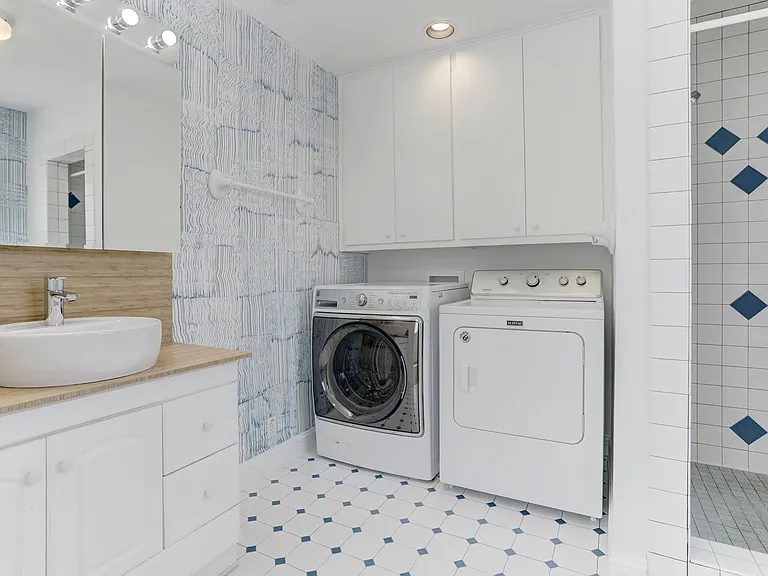 Primary bathroom with washer & dryer provided.