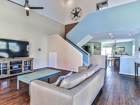 Another view of the living room with pine wood floors