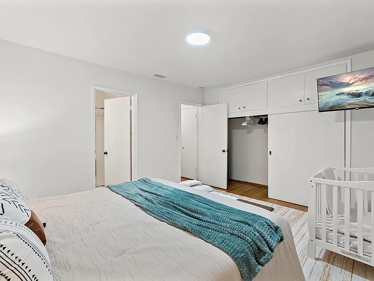 Unwind in style with a bedroom featuring a smart TV for endless entertainment.