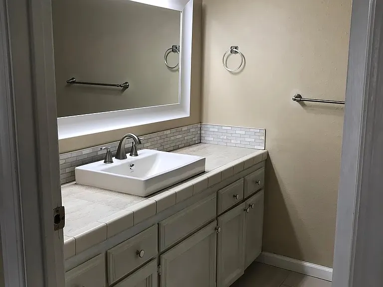 Full second bathroom in large Master bedroom with newly tiled shower, counter and floor.