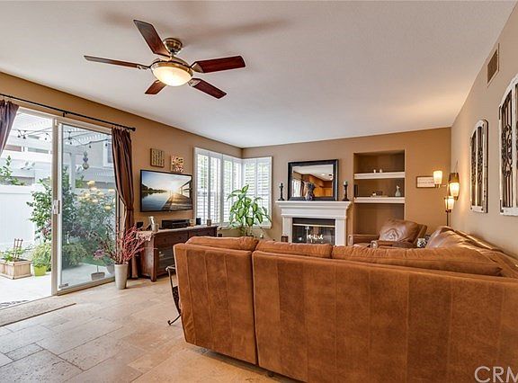 Family room with fire place and sliding doors to side yard