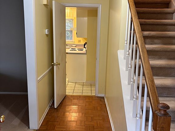 Front entrance hallway. Living room on left, kitchen straight ahead.