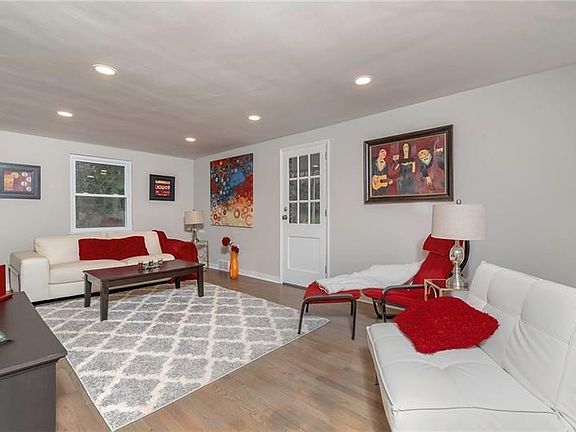 Entertain Family & Friends in the Living Room. Notice the Refinished Hardwood Floors and Recessed Lighting.