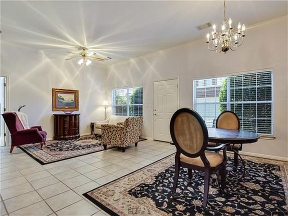 Light and bright with easy-to-maintain hard tile flooring in the living and dining areas.