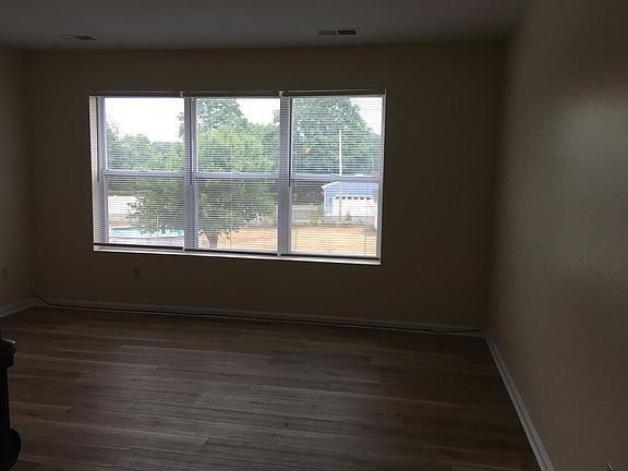 Great view of the neighborhood from the living room area. New flooring.