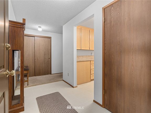View of entry, nice large closet, hall and kitchen. 