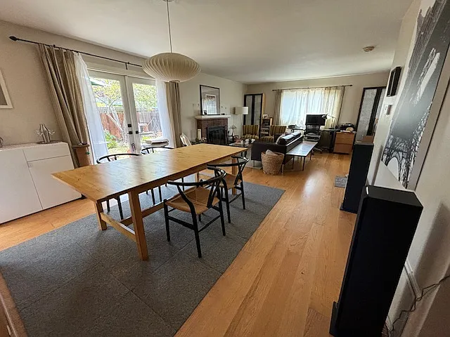Dinning room with living room & french doors to garden