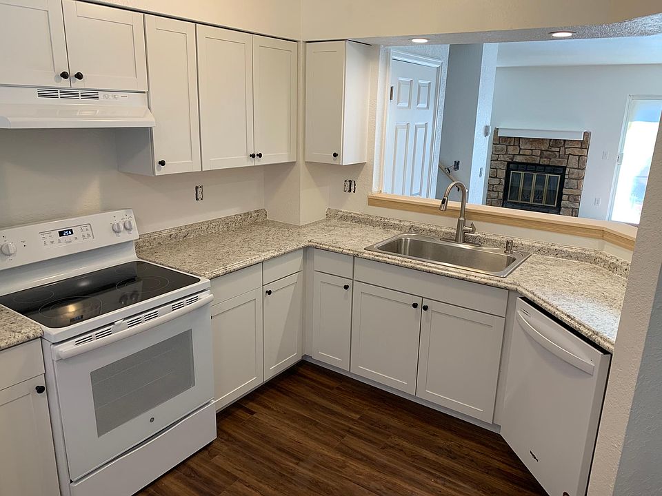 Kitchen with open view to living room, overhead LED dimmable lighting