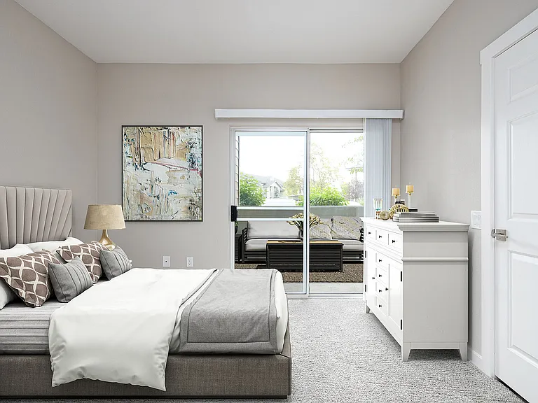 Experience serene living in this elegantly designed bedroom with access to a private patio.