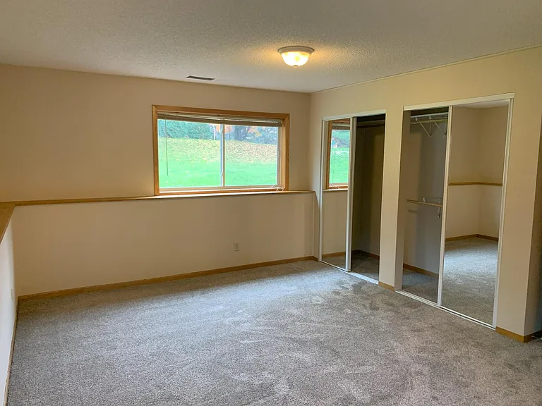 Huge lower level bedroom with double closet and private access to 3/4 bathroom.
