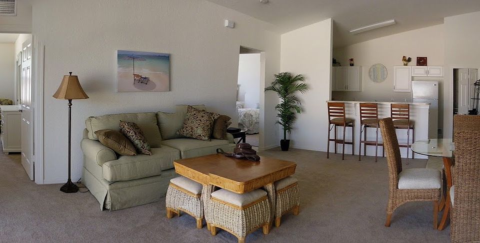 Open floor plan with spacious living room and vaulted ceilings.