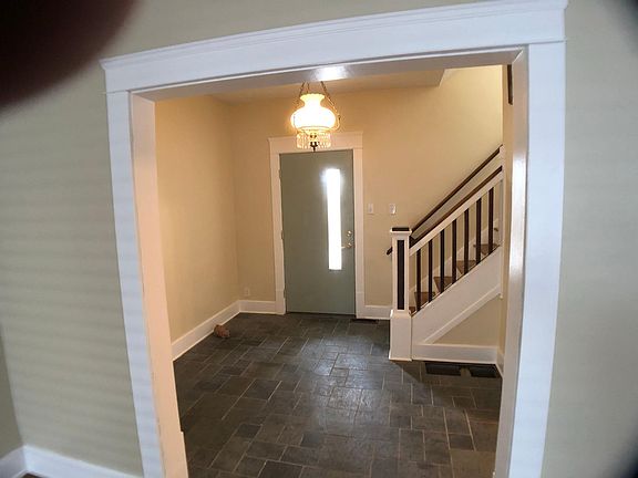 This is the foyer viewed from the living room. Slate flooring.