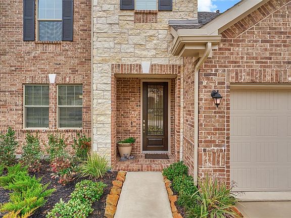Stone and Brick on the exterior with a welcoming covered porch. 3 car garage with epoxy floor!