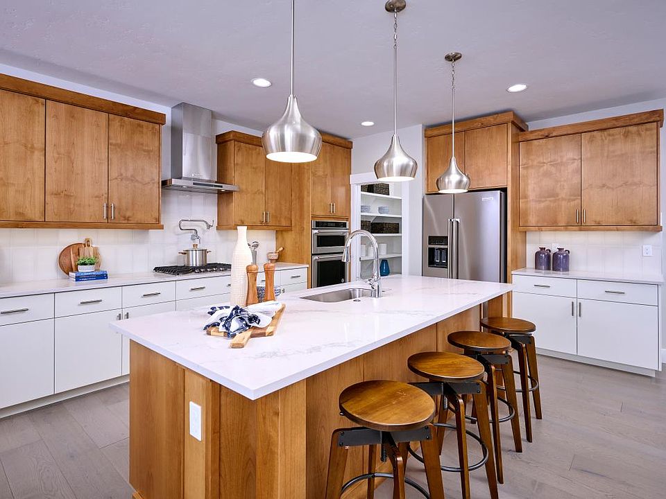 Open kitchen with two-tone cabinets