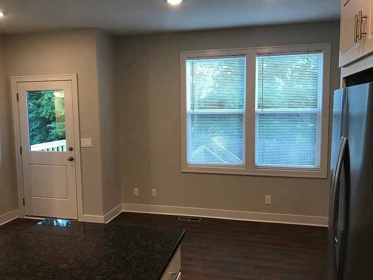 Breakfast area and back door to deck