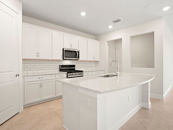 42 white cabinets with quartz counters