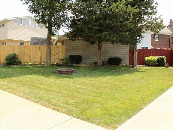 The yard in front can be used for entertaining, relaxing, or just enjoying a green space so close to the city.